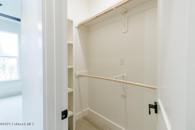 7450 55th St, Lubbock, TX 79407 - walk in closet with carpet flooring