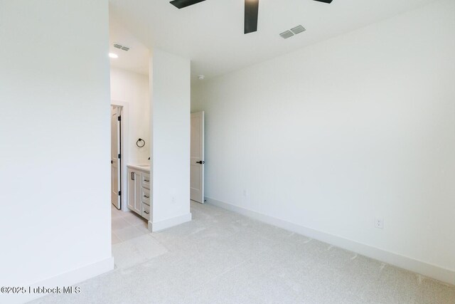 7450 55th St, Lubbock, TX 79407 - spare room with light carpet, a ceiling fan, and baseboards