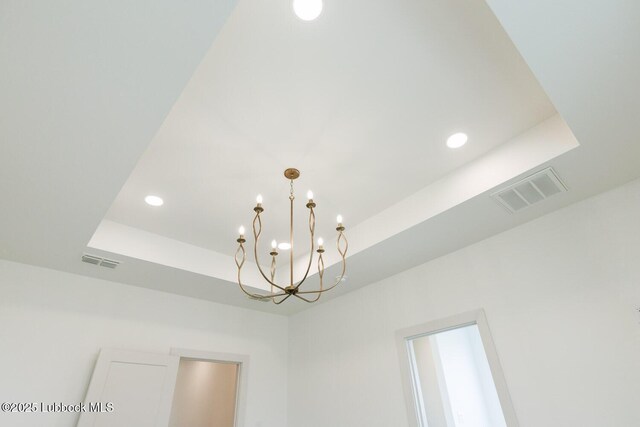 7450 55th St, Lubbock, TX 79407 - detailed view of a chandelier, a tray ceiling, and recessed lighting