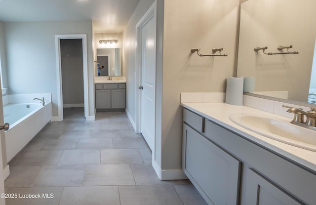 3202 Venita Ave, Lubbock, TX 79407 - bathroom featuring vanity, a bath, and tile patterned floors