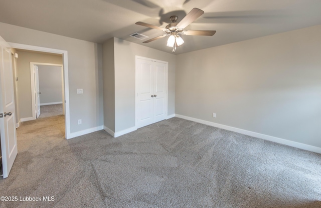 3202 Venita Ave, Lubbock, TX 79407 - unfurnished bedroom with carpet, a closet, and ceiling fan