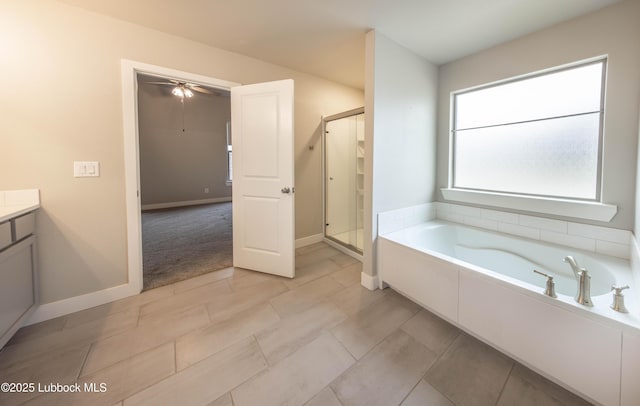 3202 Venita Ave, Lubbock, TX 79407 - full bath with a shower stall, a garden tub, vanity, and ceiling fan