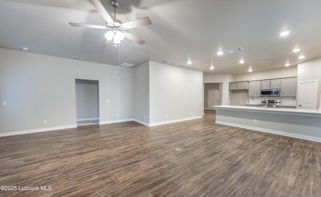 3202 Venita Ave, Lubbock, TX 79407 - unfurnished living room featuring recessed lighting, dark wood-type flooring, and ceiling fan