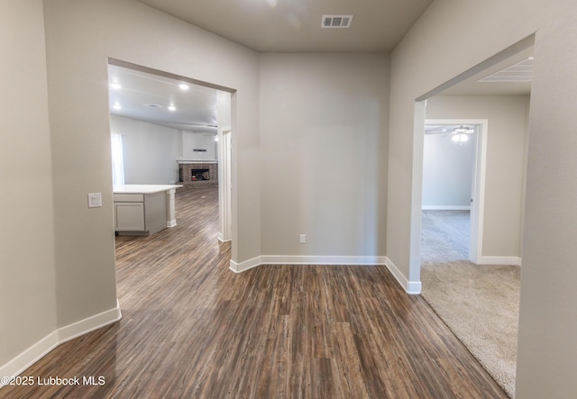 3202 Venita Ave, Lubbock, TX 79407 - hall featuring dark wood-type flooring and baseboards