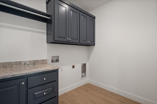 clothes washing area featuring cabinets, washer hookup, hookup for an electric dryer, and light wood-type flooring