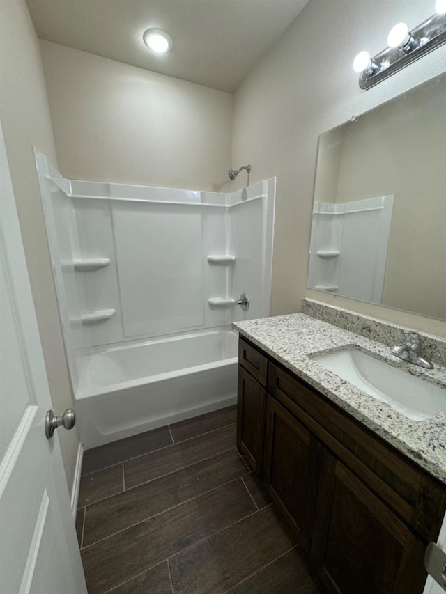 bathroom with shower / washtub combination and vanity