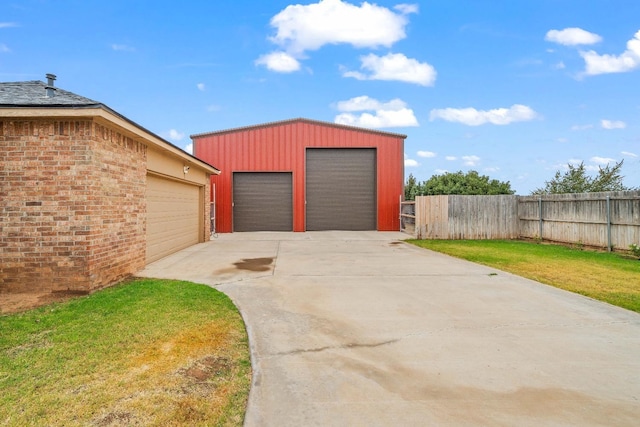 garage featuring a lawn