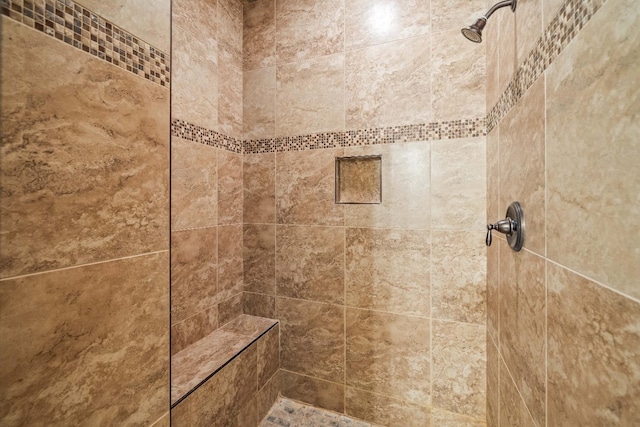 bathroom featuring tiled shower