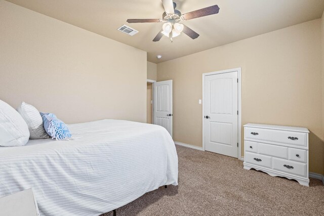 bedroom featuring ceiling fan and light carpet