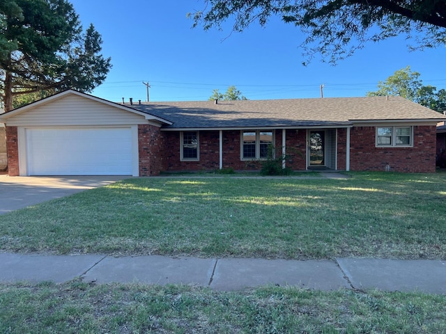 ranch-style house featuring brick siding, a shingled roof, a front yard, a garage, and driveway