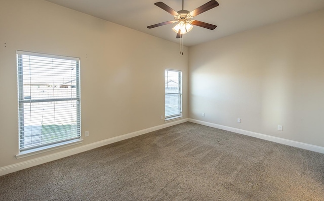 unfurnished room featuring ceiling fan and carpet floors