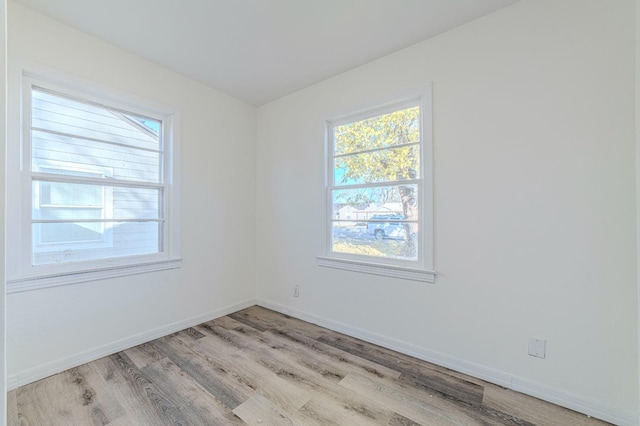 spare room featuring light hardwood / wood-style floors