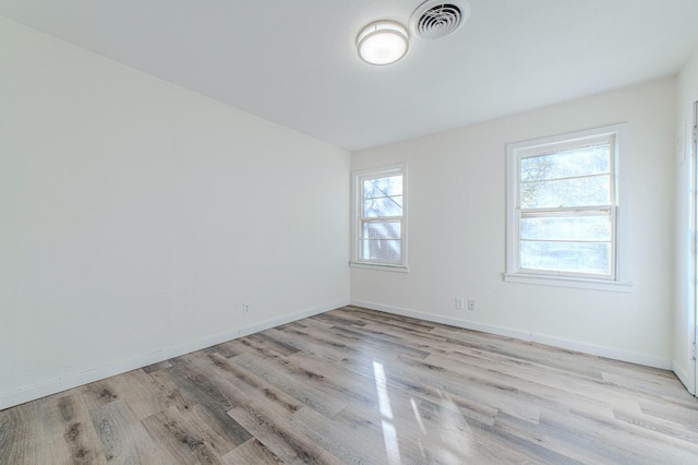 unfurnished room featuring light wood-type flooring