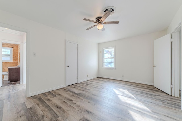 unfurnished bedroom featuring ceiling fan and light wood-type flooring