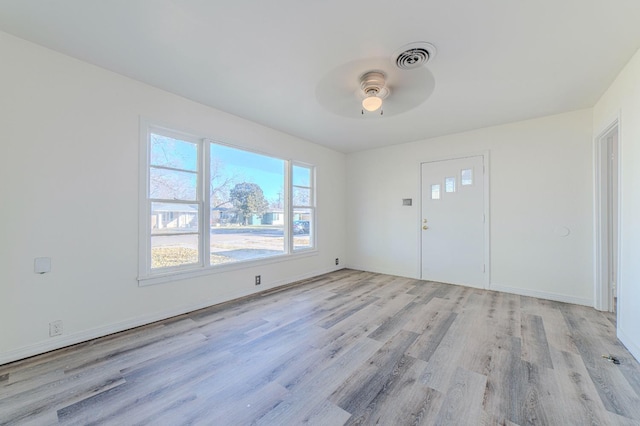 entryway with ceiling fan and light hardwood / wood-style flooring