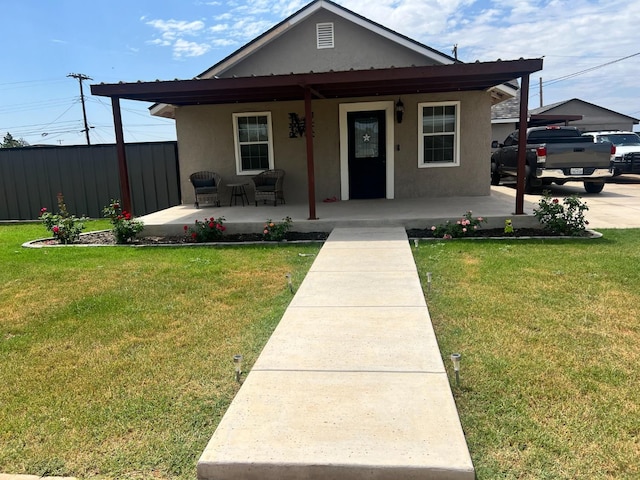 bungalow featuring a front yard and covered porch