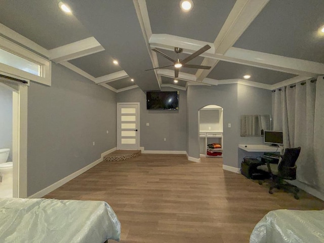 bedroom with hardwood / wood-style flooring and vaulted ceiling with beams