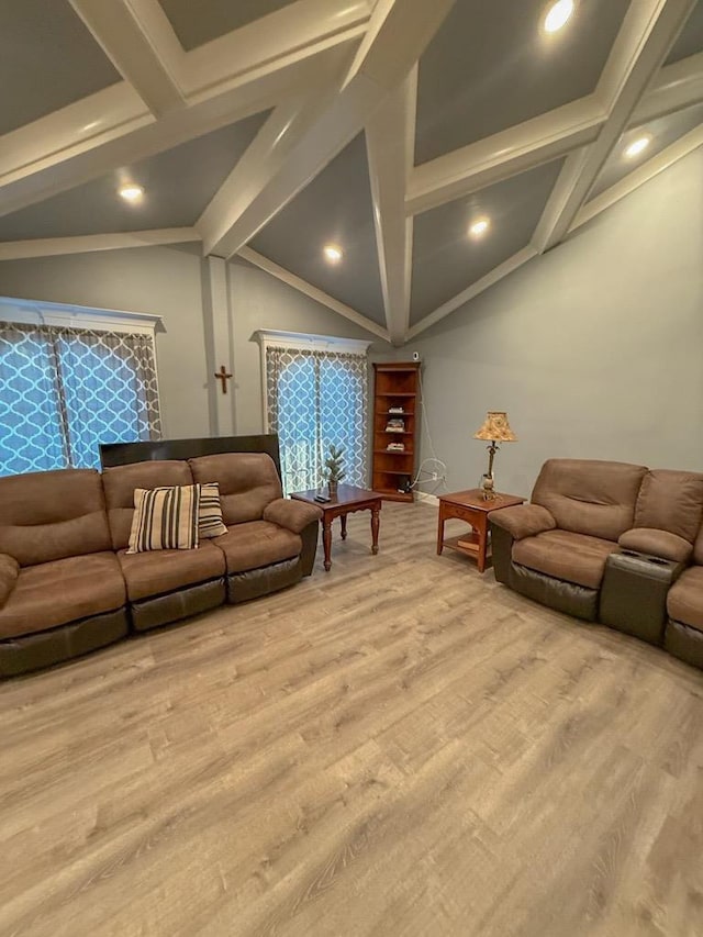 living room featuring hardwood / wood-style floors and lofted ceiling with beams