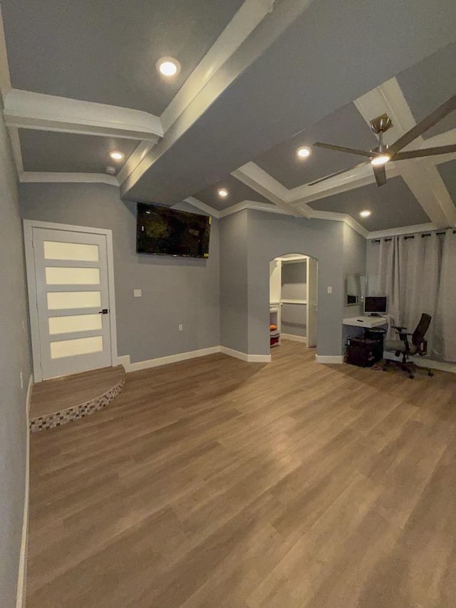 unfurnished living room with hardwood / wood-style floors, beamed ceiling, and ceiling fan