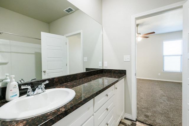 bathroom with vanity and ceiling fan