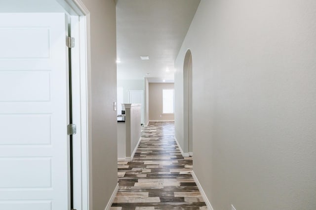 hall with dark hardwood / wood-style floors