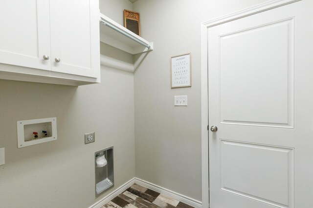 clothes washing area featuring cabinets, hookup for an electric dryer, and hookup for a washing machine