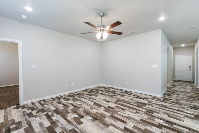 empty room with hardwood / wood-style flooring and ceiling fan