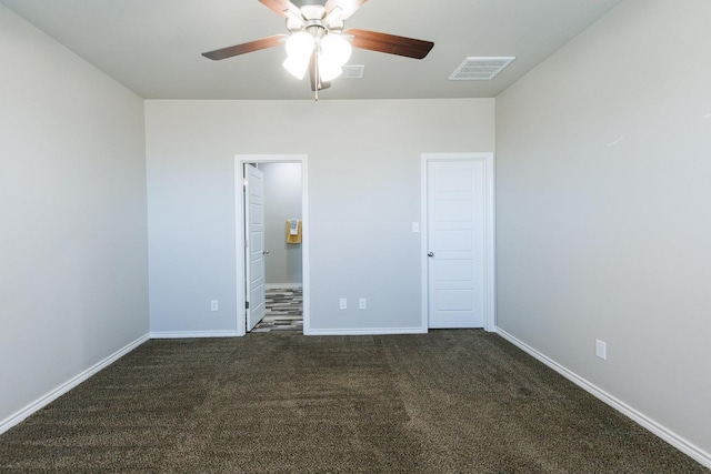 unfurnished room featuring ceiling fan and dark carpet