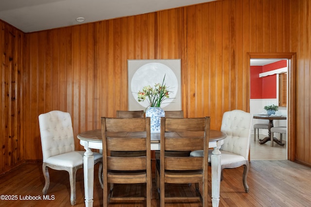 2005 32nd St, Lubbock, TX 79411 - dining room with hardwood / wood-style flooring and wooden walls