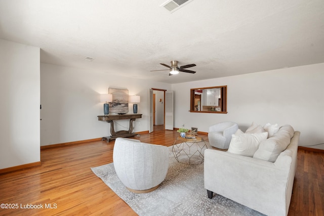 2005 32nd St, Lubbock, TX 79411 - living area with a ceiling fan, baseboards, and wood finished floors