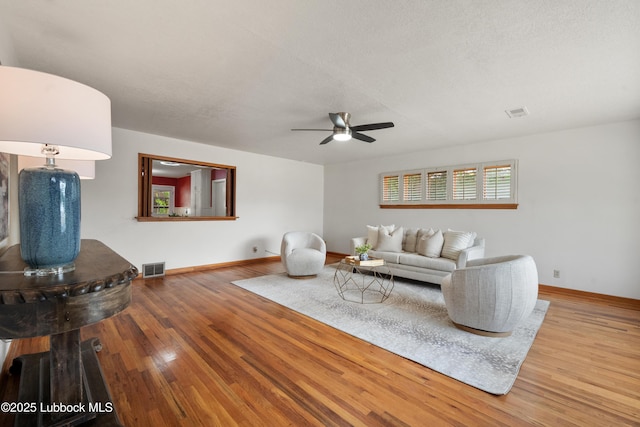 2005 32nd St, Lubbock, TX 79411 - living area featuring baseboards, ceiling fan, and wood finished floors