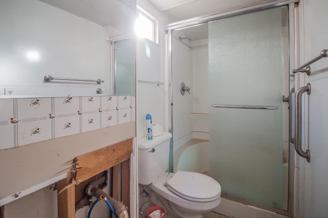 bathroom featuring an enclosed shower and toilet