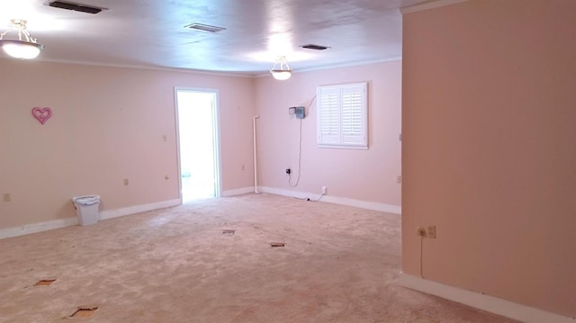 empty room with carpet floors and ornamental molding