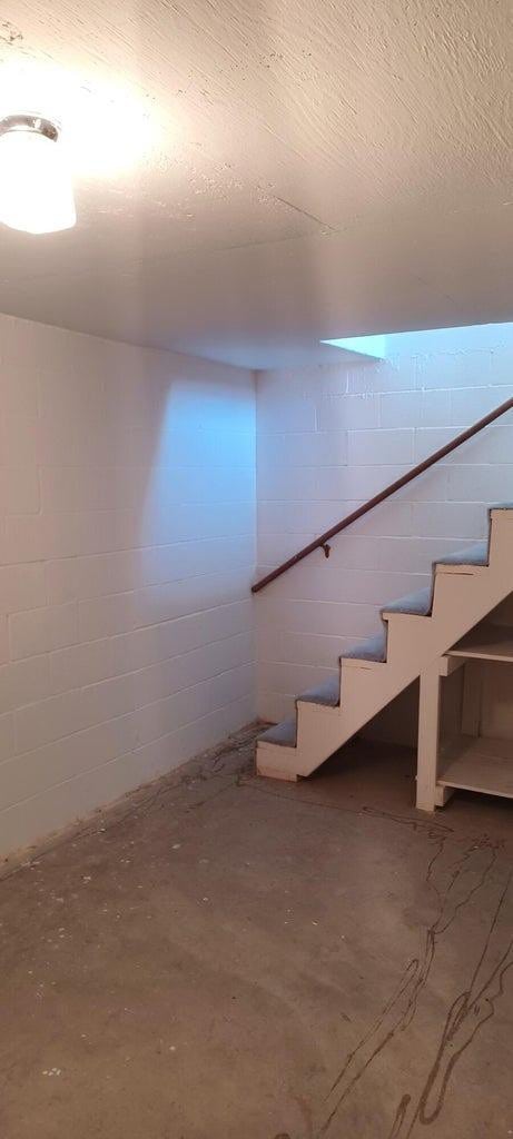 basement with a textured ceiling