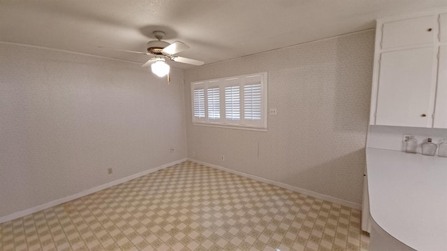 spare room with ceiling fan