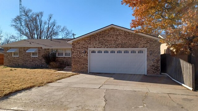 ranch-style home with a garage