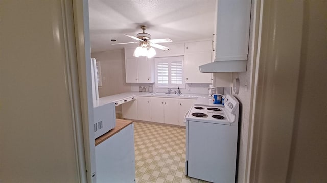 kitchen featuring dishwashing machine, sink, white electric range, ceiling fan, and white cabinetry