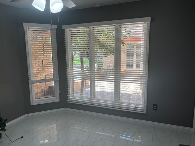 unfurnished dining area with ceiling fan