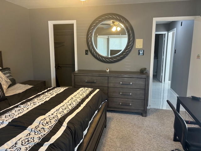 bedroom featuring light carpet and a closet