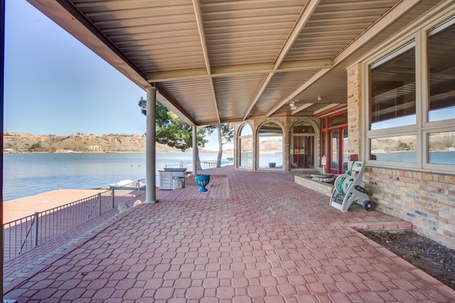 view of patio featuring a water view