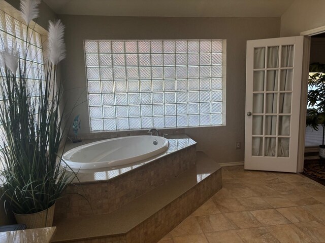 bathroom with tiled tub