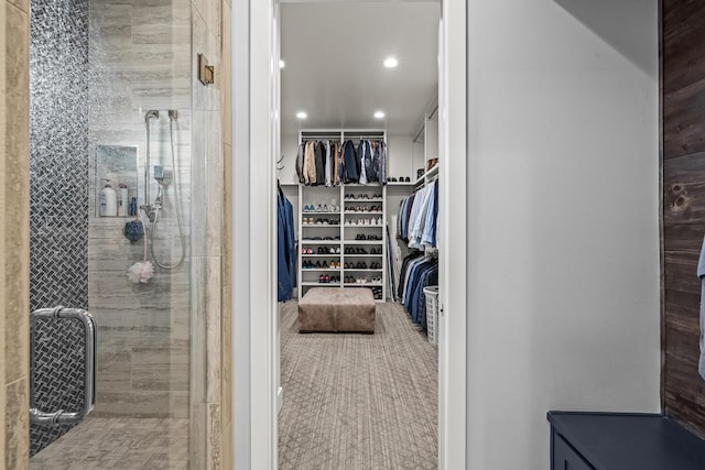 7733 46th St, Lubbock, TX 79407 - bathroom featuring a stall shower, a walk in closet, and recessed lighting