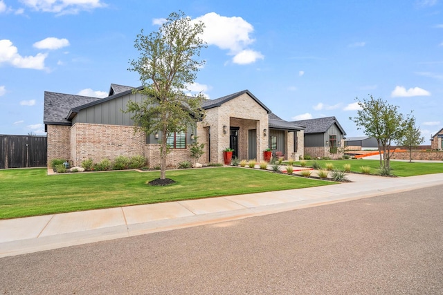 7733 46th St, Lubbock, TX 79407 - view of front of house with brick siding and board and batten siding
