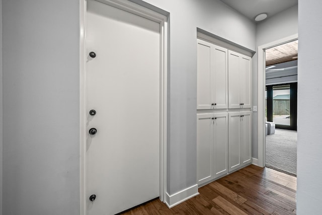 7733 46th St, Lubbock, TX 79407 - hallway featuring dark wood-style flooring and baseboards