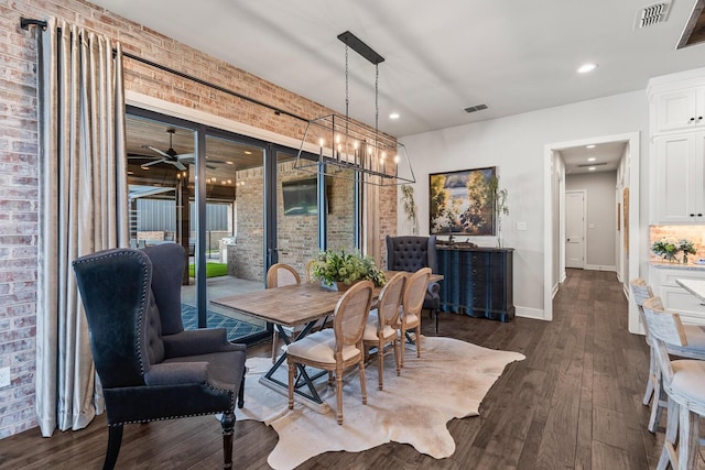 7733 46th St, Lubbock, TX 79407 - dining area with dark wood finished floors, brick wall, ceiling fan, and recessed lighting