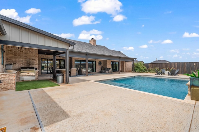 7733 46th St, Lubbock, TX 79407 - view of pool with an outdoor kitchen, a patio area, and a fenced backyard