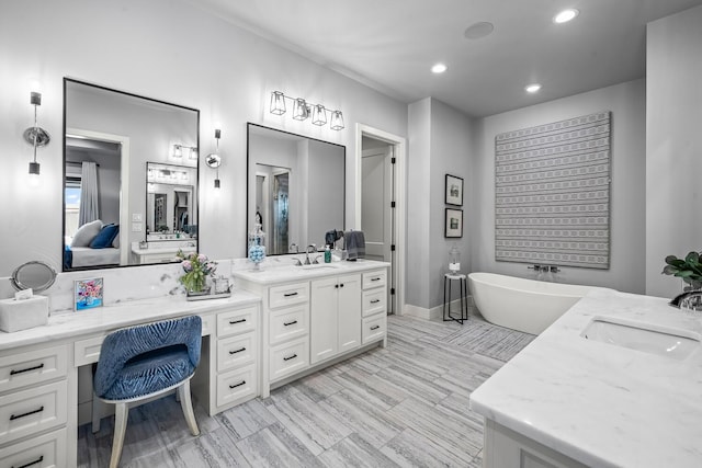 7733 46th St, Lubbock, TX 79407 - bathroom featuring vanity, a soaking tub, recessed lighting, and connected bathroom