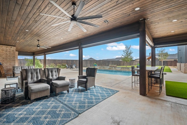 7733 46th St, Lubbock, TX 79407 - fenced backyard featuring an outdoor living space, a patio area, and a ceiling fan