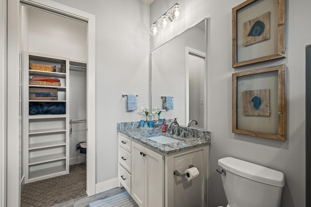 7733 46th St, Lubbock, TX 79407 - bathroom with vanity and a walk in closet