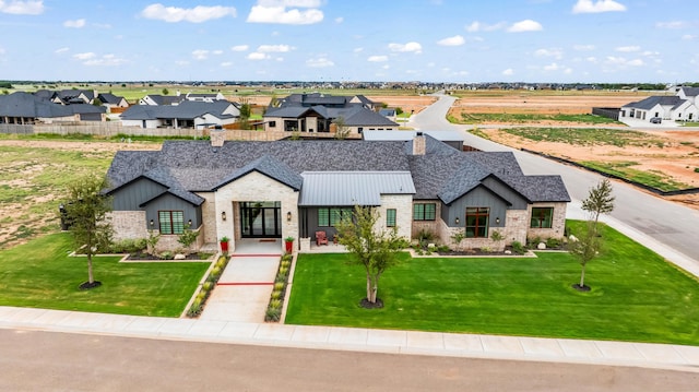 7733 46th St, Lubbock, TX 79407 - view of front facade with board and batten siding, a chimney, a residential view, stone siding, and a standing seam roof
